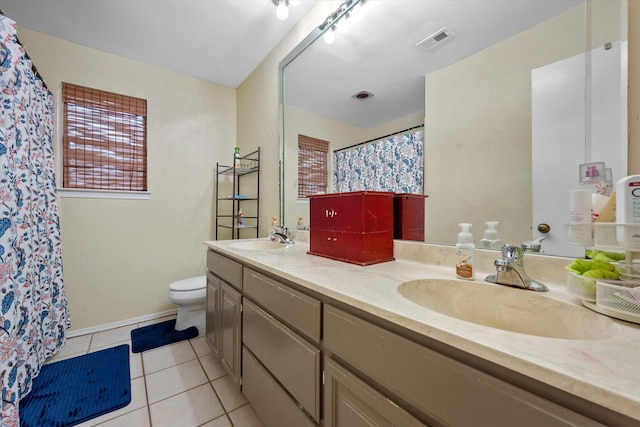 bathroom with toilet, tile patterned flooring, double vanity, and a shower with curtain