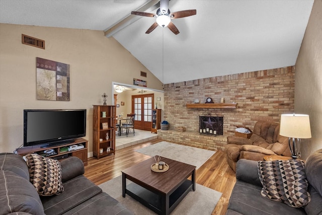 living room featuring wood finished floors and a ceiling fan