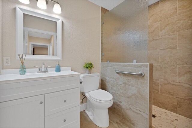 full bath featuring walk in shower, toilet, and vanity