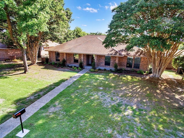 309 Rash Ln, Terrell, TX 75160 - view of front of house with brick siding, a front yard, and roof with shingles
