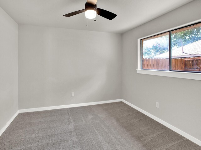 309 Rash Ln, Terrell, TX 75160 - empty room featuring carpet floors, baseboards, and a ceiling fan