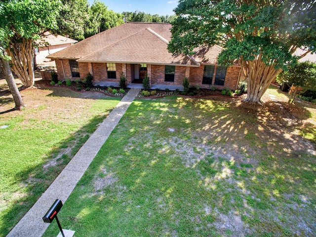 309 Rash Ln, Terrell, TX 75160 - ranch-style home with brick siding, a front yard, roof with shingles, and covered porch