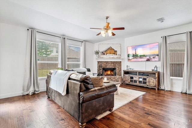 6273 El Capitan St, Fort Worth, TX 76179 - living area featuring a ceiling fan, dark wood-style flooring, a fireplace, and baseboards