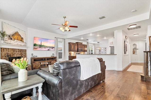 6273 El Capitan St, Fort Worth, TX 76179 - living room with a ceiling fan, wood finished floors, a fireplace, and baseboards