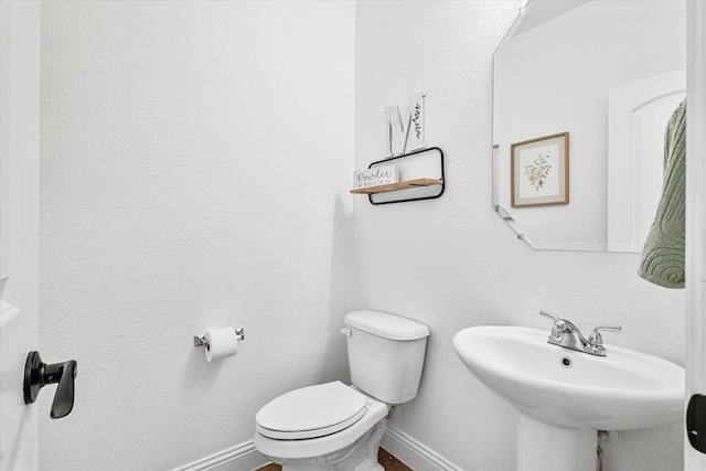 6273 El Capitan St, Fort Worth, TX 76179 - bathroom with a sink, toilet, and baseboards
