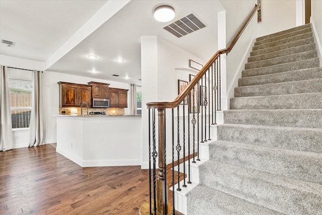 6273 El Capitan St, Fort Worth, TX 76179 - staircase with wood finished floors, baseboards, and recessed lighting