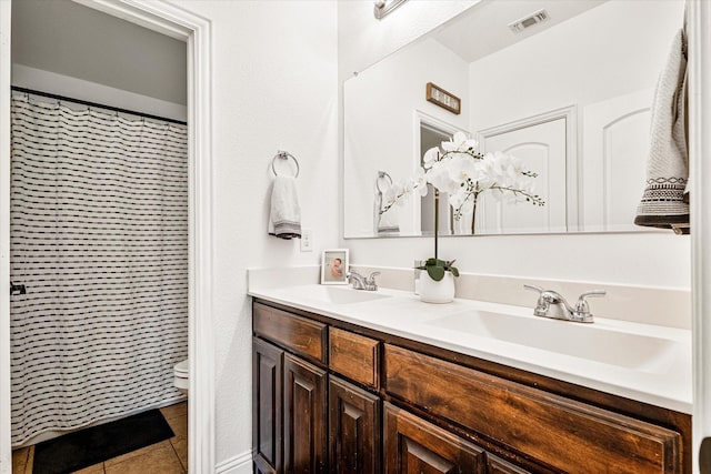 6273 El Capitan St, Fort Worth, TX 76179 - full bath featuring double vanity, tile patterned flooring, and toilet