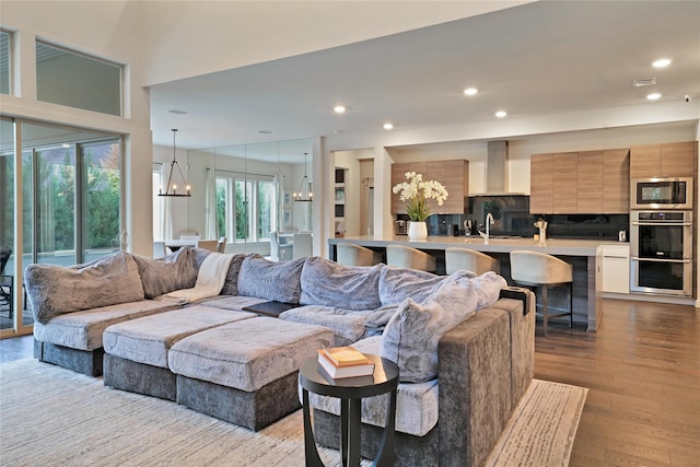 3520 Valmur Ave, Colleyville, TX 76034 - living area featuring wood finished floors, a chandelier, and recessed lighting