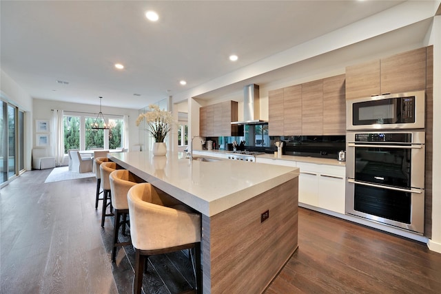 3520 Valmur Ave, Colleyville, TX 76034 - kitchen featuring modern cabinets, wall chimney exhaust hood, a sink, stainless steel appliances, and recessed lighting