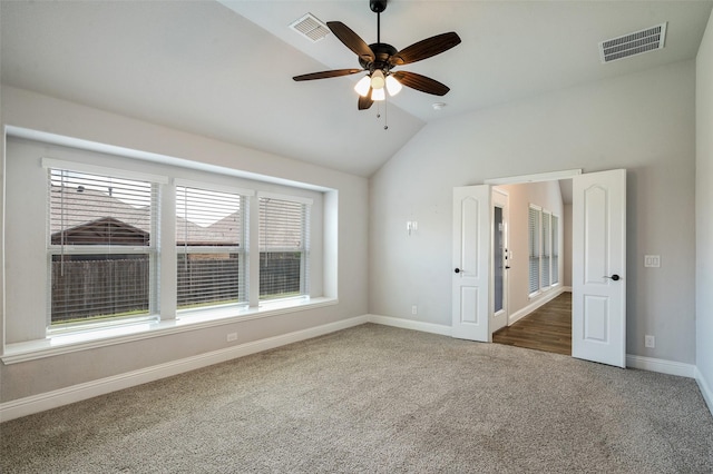 9117 Amistad Ln, Denton, TX 76226 - carpeted spare room with lofted ceiling, baseboards, and a ceiling fan