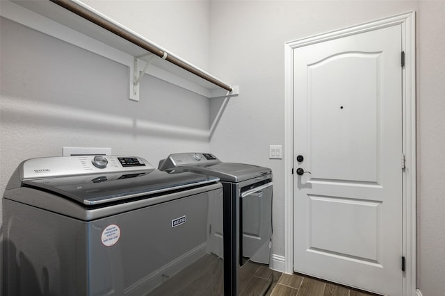 9117 Amistad Ln, Denton, TX 76226 - laundry area with independent washer and dryer and wood tiled floors