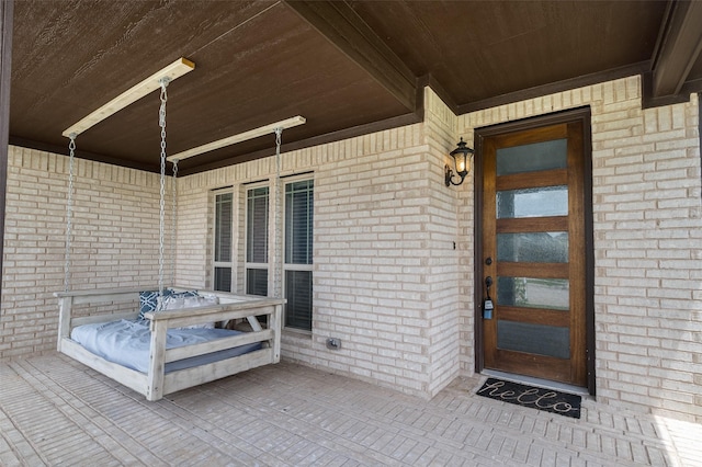 9117 Amistad Ln, Denton, TX 76226 - entrance to property with a porch and brick siding