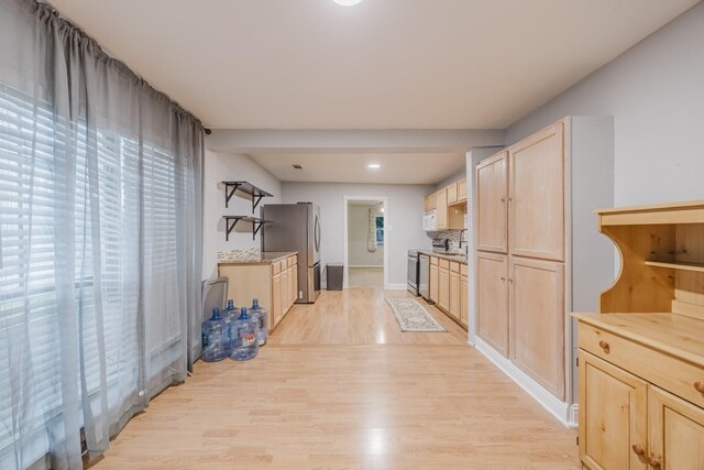 hall with light wood-type flooring, recessed lighting, and baseboards