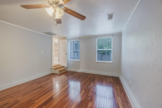empty room with hardwood / wood-style floors, ceiling fan, and baseboards