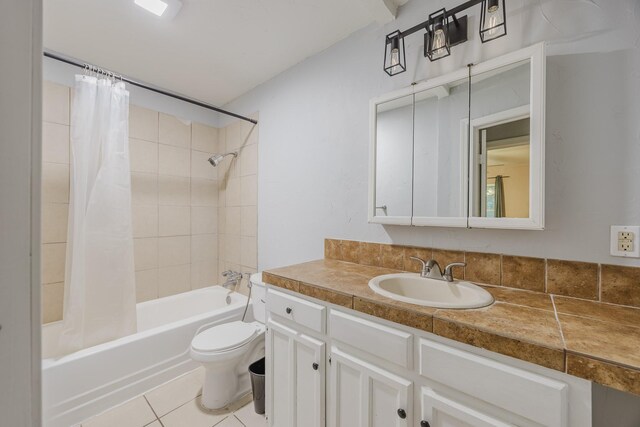 full bath with tile patterned flooring, shower / tub combo, toilet, and vanity