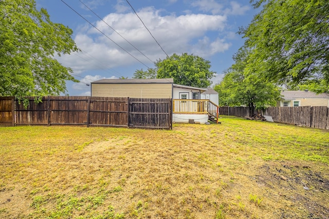 view of yard with a wooden deck