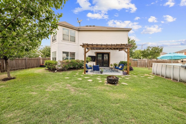 1800 Grassland Dr, Leander, TX 78641 - rear view of house with a fire pit, a pergola, french doors, and a patio area