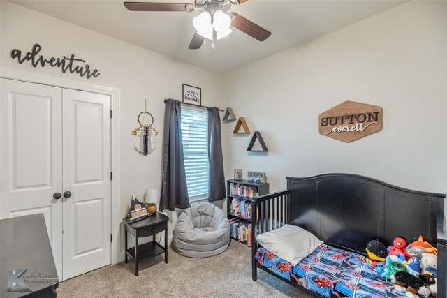 carpeted bedroom featuring a ceiling fan