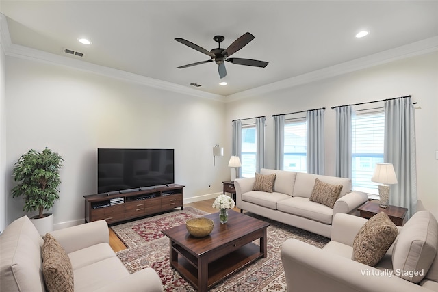 2425 Plymouth Rock Rd, Abilene, TX 79601 - living room with ornamental molding, plenty of natural light, a ceiling fan, baseboards, and wood finished floors
