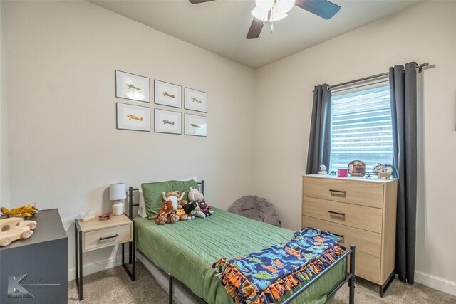bedroom with light carpet, baseboards, and ceiling fan