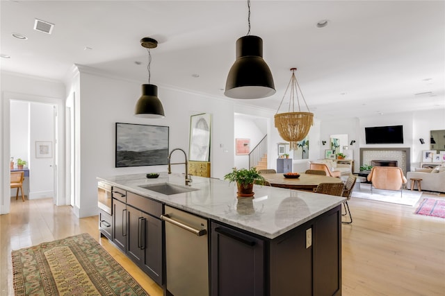 6905 Northridge Dr, Dallas, TX 75214 - kitchen with a sink, ornamental molding, dishwasher, a fireplace, and pendant lighting