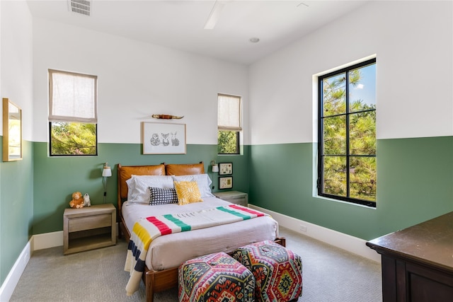 6905 Northridge Dr, Dallas, TX 75214 - carpeted bedroom featuring multiple windows, ceiling fan, and baseboards