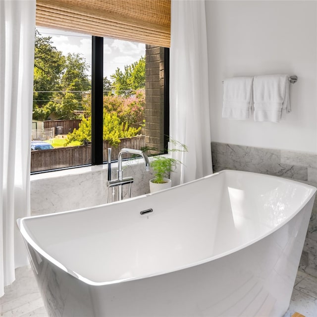 6905 Northridge Dr, Dallas, TX 75214 - full bathroom featuring a sink, marble finish flooring, and a soaking tub