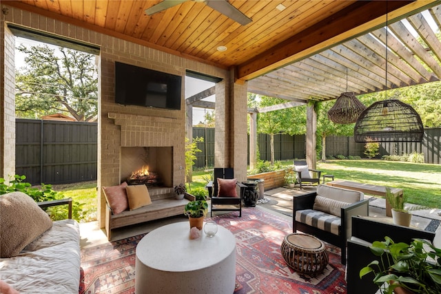 6905 Northridge Dr, Dallas, TX 75214 - view of patio / terrace with an outdoor living space with a fireplace and a ceiling fan