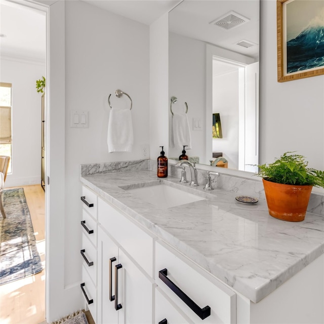 6905 Northridge Dr, Dallas, TX 75214 - bathroom with vanity and wood finished floors