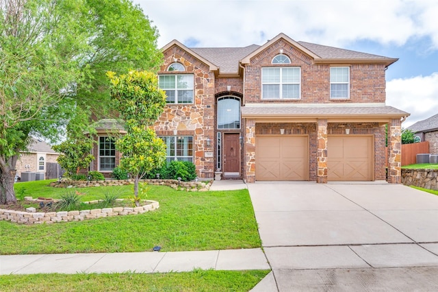 314 Trakehner Trl, Celina, TX 75009 - view of front facade featuring driveway, a front yard, an attached garage, central AC unit, and a shingled roof