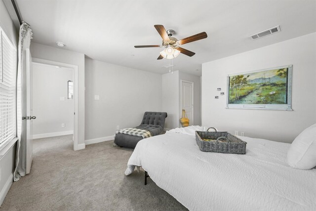 bedroom featuring carpet flooring, baseboards, and a ceiling fan