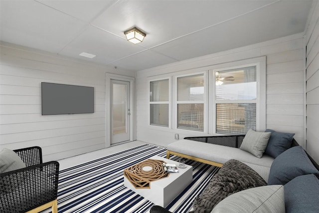 living room with wood walls
