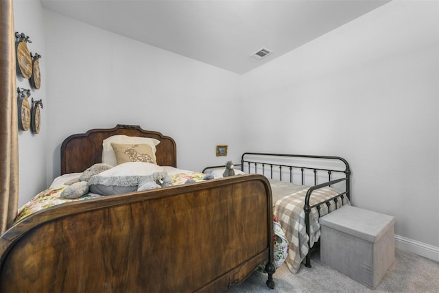 bedroom featuring carpet, baseboards, and vaulted ceiling