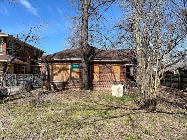 218 E 5th St, Dallas, TX 75203 - rear view of house with brick siding and fence