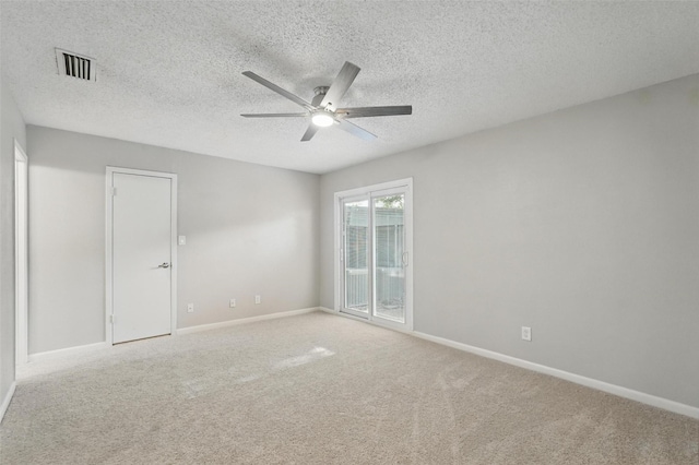 9826 Bent Branch Ln, Dallas, TX 75243 - unfurnished room with a ceiling fan, baseboards, and light carpet