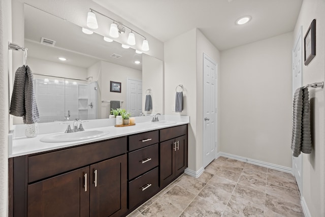 3249 Glorioso Dr, Royse City, TX 75189 - full bath with a shower stall, double vanity, and baseboards