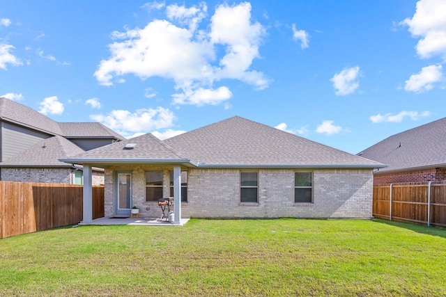 3249 Glorioso Dr, Royse City, TX 75189 - rear view of house featuring a patio area, a shingled roof, and brick siding