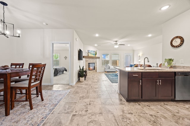 3249 Glorioso Dr, Royse City, TX 75189 - kitchen with dishwasher, a sink, ceiling fan, open floor plan, and a chandelier