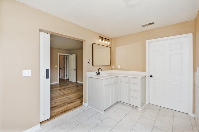 1941 State Highway 59 S, Bowie, TX 76230 - bathroom featuring baseboards and vanity