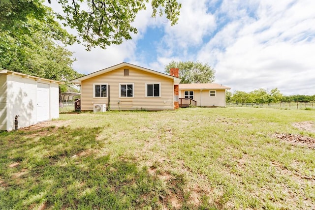 1941 State Highway 59 S, Bowie, TX 76230 - back of house featuring an outbuilding, a chimney, a shed, and a garage