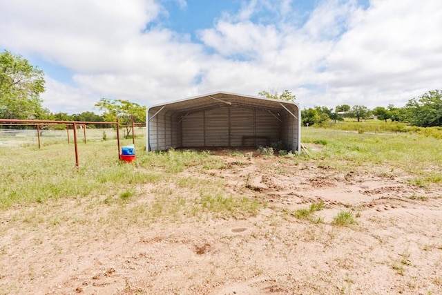 1941 State Highway 59 S, Bowie, TX 76230 - garage featuring a detached carport