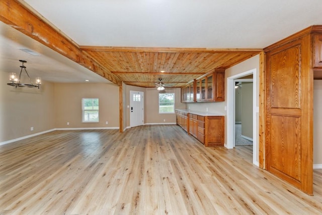 1941 State Highway 59 S, Bowie, TX 76230 - kitchen with brown cabinetry, plenty of natural light, light wood-type flooring, and wooden ceiling