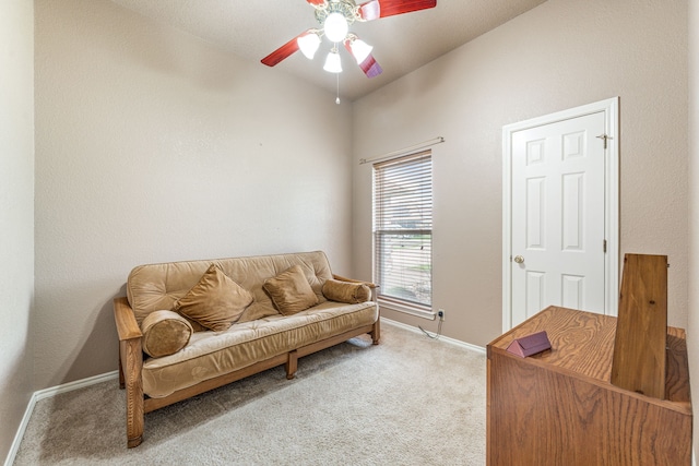 living area with carpet floors, baseboards, and ceiling fan