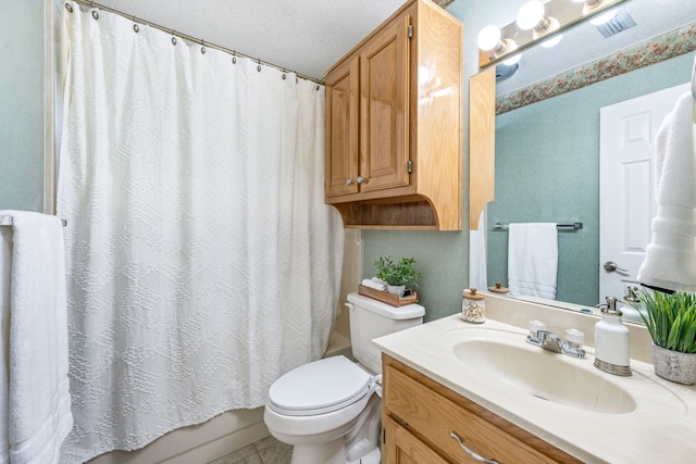 full bathroom with toilet, vanity, tile patterned floors, and a textured ceiling