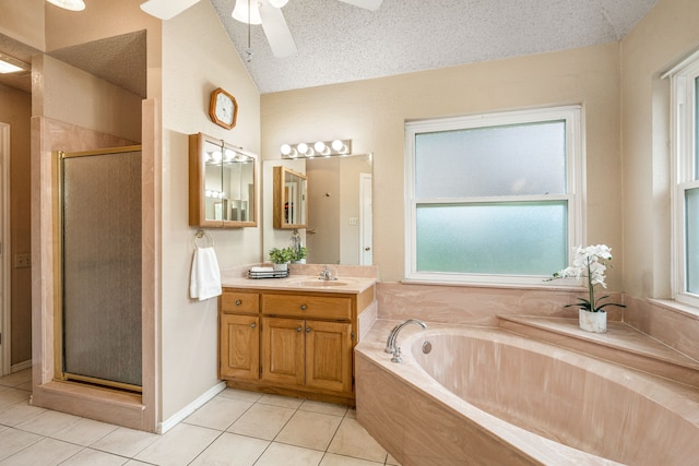 bathroom with tile patterned flooring, a stall shower, a bath, vanity, and plenty of natural light