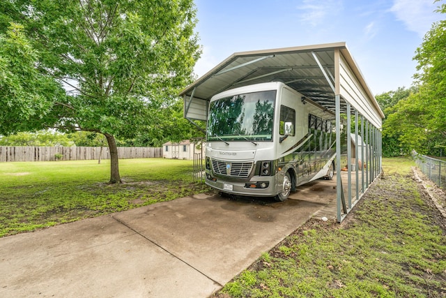 view of parking with a carport and a storage unit
