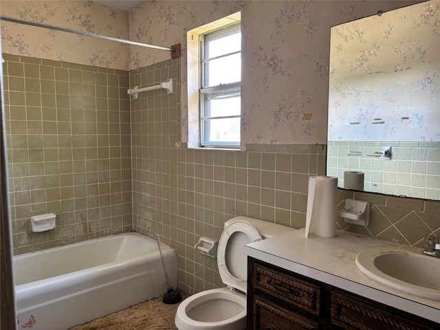 3122 Frances Dr, Denison, TX 75020 - full bath with tile walls, wallpapered walls, vanity, shower / washtub combination, and wainscoting