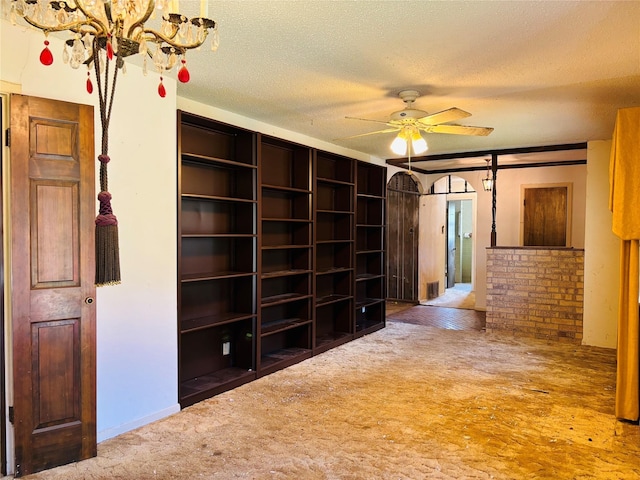 3122 Frances Dr, Denison, TX 75020 - spare room with carpet flooring, a textured ceiling, ceiling fan, and a chandelier