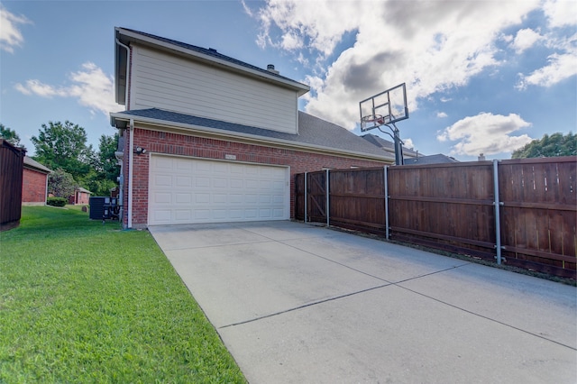 view of side of home with an attached garage, concrete driveway, brick siding, and a shingled roof