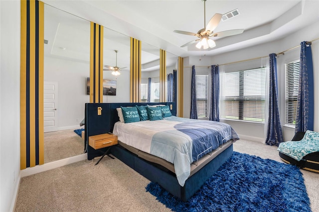 2507 Henley Way, Mansfield, TX 76084 - carpeted bedroom featuring baseboards, a tray ceiling, and a ceiling fan